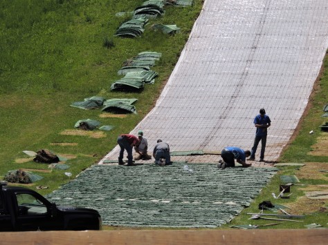 Installing the summer jumping surface on the ski jumps
